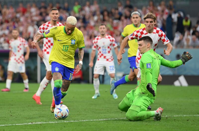 Neymar rounds the keeper before scoring for Brazil. Getty