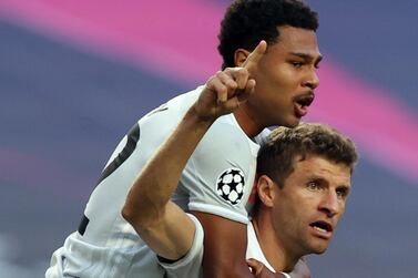 Thomas Mueller celebrates with teammate Serge Gnabry after scoring the opening goal. EPA  