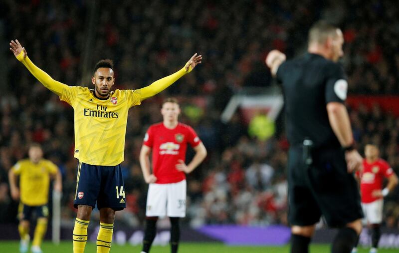 Arsenal's Pierre-Emerick Aubameyang reacts after referee awards the goal after a VAR review. Reuters