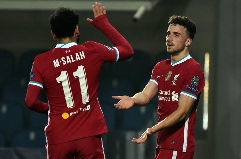 epa08796537 Liverpool's Diogo Jota (R) jubilates after scoring the 1-0 during the UEFA Champions League Group D soccer match Atalanta BC vs Liverpool at Gewiss Stadium in Bergamo, Italy, 03 November 2020.  EPA/PAOLO MAGNI