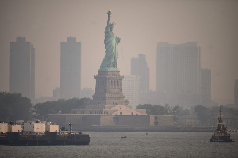 The Statue of Liberty from the Staten Island Ferry during heavy smog in New York on June 6. AFP