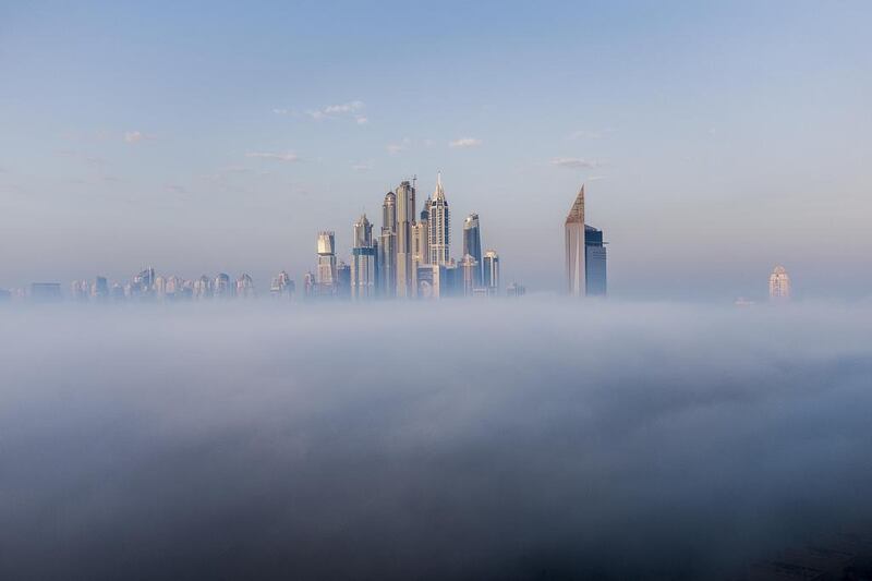 Early morning fog around the Dubai Marina area. Antonie Robertson / The National
