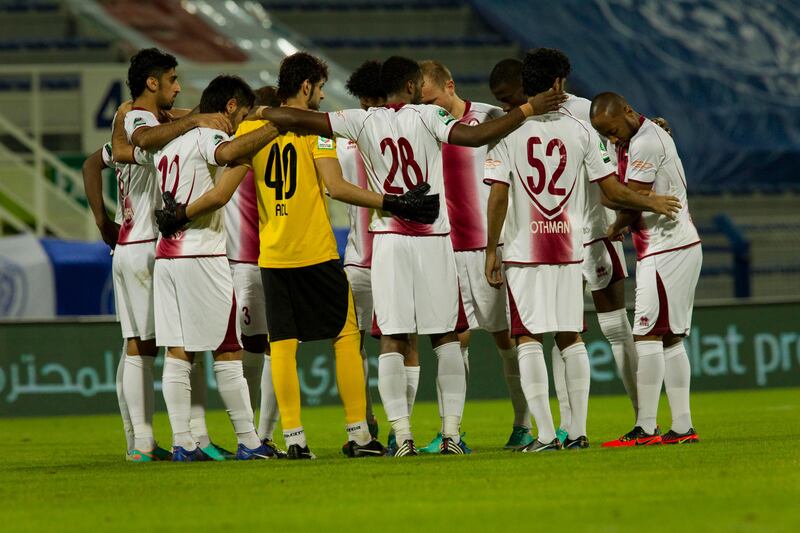 Dubai, United Arab Emirates - November 18 2012 - Al Wahda gather for a team huddle prior to the second half of the match.  Al Nasr beat Al Wahda 4-1 at Al Nasr Stadium on Sunday night. (Razan Alzayani / The National) 