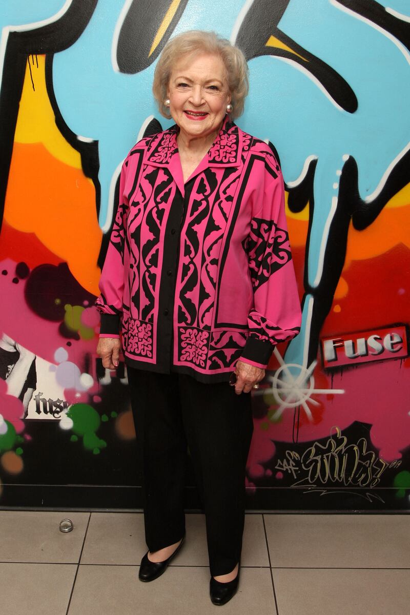 Betty White, in a black and pink shirt, visits Fuse Studios on June 11, 2009, in New York City.   AFP