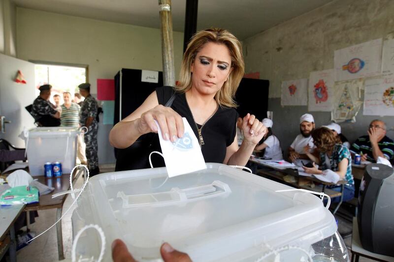 A woman casts her vote at a polling station in the village of Brih, Lebanon. Aziz Taher  / Reuters