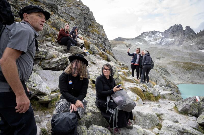 People take part in a ceremony to mark the 'death' of the Pizol glacier (Pizolgletscher) above Mels, eastern Switzerland.AFP