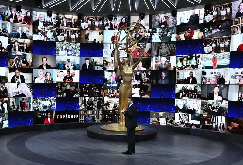 Jimmy Kimmel stands in front of a wall of nominees watching remotely at the Staples Center during the 72nd Primetime Emmy Awards ceremony held. AFP