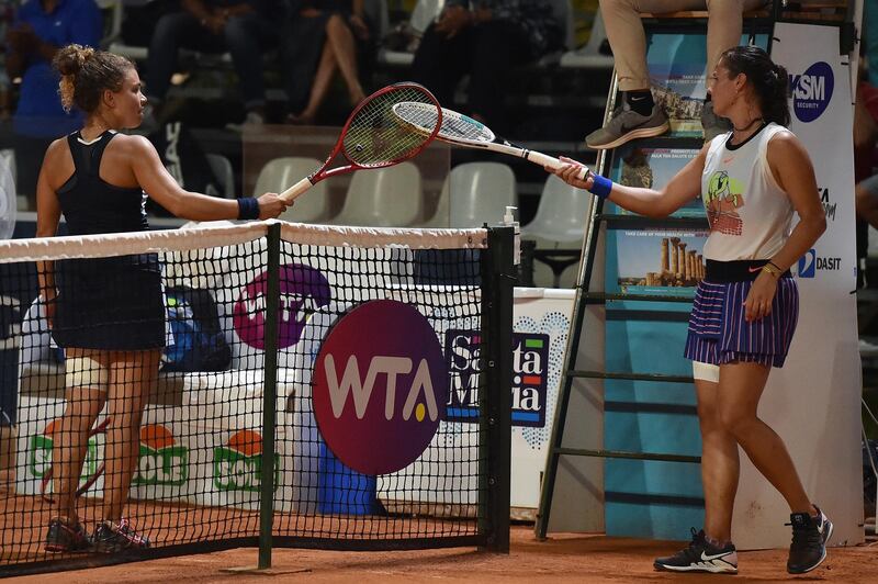 Jasmine Paolini of Italy touches rackets with Daria Kasatkina of Russia after their singles match during the 31st Palermo Ladies Open - Day One in Palermo, Italy. Getty Images
