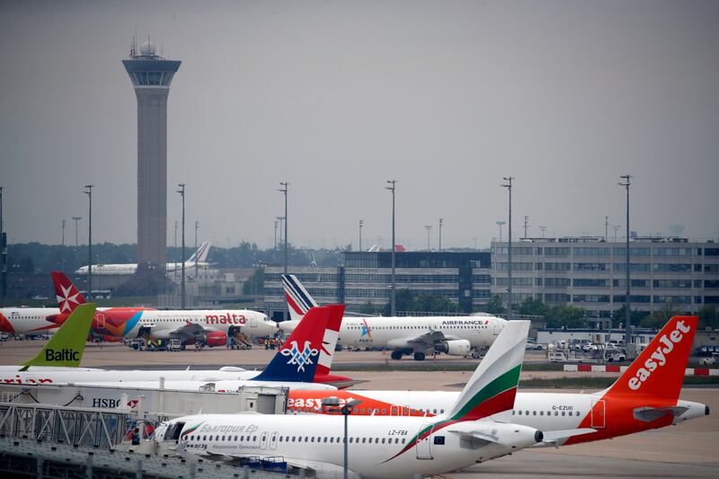 Planes at Paris Charles de Gaulle Airport. The EU is stepping up measures that will move air travel towards more sustainable fuels. AP
