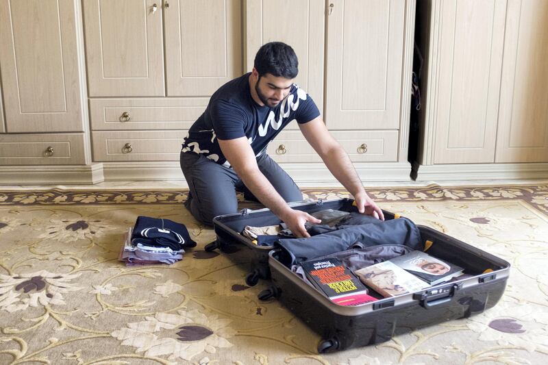 SHARJAH, UNITED ARAB EMIRATES - AUG 15: 

Omar Al Ansari, a 22-year-old Emirati who is studying at the Arizona State University, packs his bag for his final semester.

(Photo by Reem Mohammed/The National)

Reporter: Roberta Pennington
Section: NA