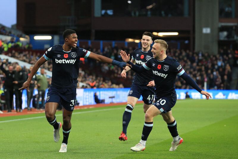 West Ham United's defender Ben Johnson, left, celebrates with Declan Rice and Jarrod Bowen after scoring the early opening goal against Aston Villa. AFP