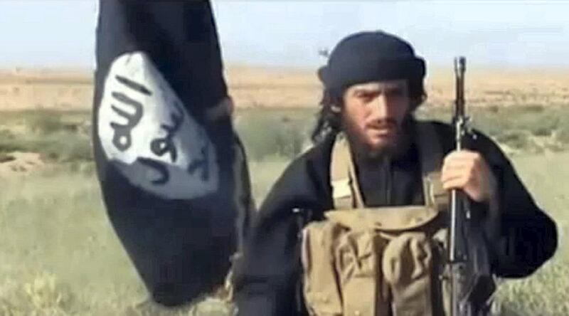 An image grab taken from a video uploaded on YouTube on July 8, 2012, shows the spokesman for the Islamic State of Iraq and the Levant (ISIL), Abu Mohammad al-Adnani al-Shami, speaking next to an Al-Qaeda-affiliated flag at an undisclosed location. AFP PHOTO / YOUTUBE == RESTRICTED TO EDITORIAL USE - MANDATORY CREDIT "AFP PHOTO / YOUTUBE " - NO MARKETING NO ADVERTISING CAMPAIGNS - DISTRIBUTED AS A SERVICE TO CLIENTS FROM FROM ALTERNATIVE SOURCES, THEREFORE AFP IS NOT RESPONSIBLE FOR ANY DIGITAL ALTERATIONS TO THE PICTURE'S EDITORIAL CONTENT, DATE AND LOCATION WHICH CANNOT BE INDEPENDENTLY VERIFIED (Photo by - / YouTube / AFP) / AFP PHOTO / YOUTUBE == RESTRICTED TO EDITORIAL USE - MANDATORY CREDIT "AFP PHOTO / YOUTUBE " - NO MARKETING NO ADVERTISING CAMPAIGNS - DISTRIBUTED AS A SERVICE TO CLIENTS FROM FROM ALTERNATIVE SOURCES, THEREFORE AFP IS NOT RESPONSIBLE FOR ANY DIGITAL ALTER