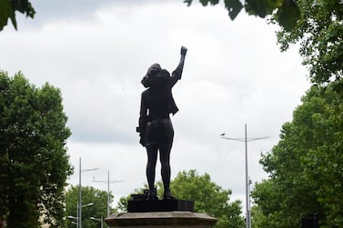 A sculpture of a Black Lives Matter protester stands on the plinth previously occupied by a statue of slave trader Edward Colston, in Bristol, Britain, July 15, 2020. Reuters