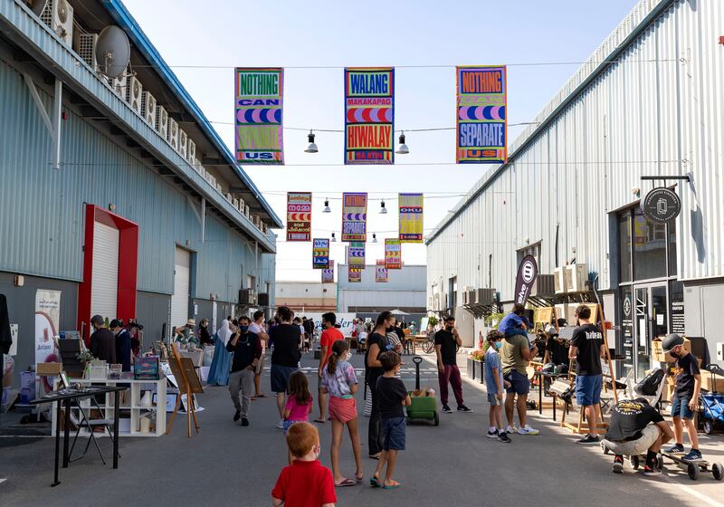 Visitors shop at Quoz Arts Fest 2022 at Alserkal Avenue, Dubai. Chris Whiteoak / The National