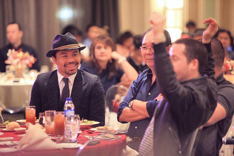 Eight-division boxing champion Manny Pacquiao attends the Christmas party for his Senatorial Office in Makati City, Metro Manila.