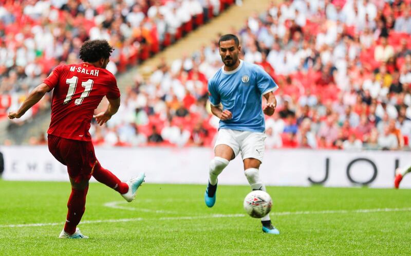 Liverpool's Mohamed Salah, left, shoots and hits the post during the second half. AP Photo