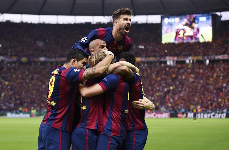 Barcelona players celebrate after beating Juventus 2-1 in the final to win the Uefa Champions League.  Dylan Martinez / Reuters

