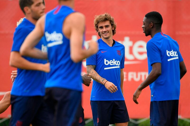 French forward Antoine Griezmann, second right, trains with his new Barcelona teammates at the Joan Gamper training ground in Sant Joan Despi near Barcelona. AFP