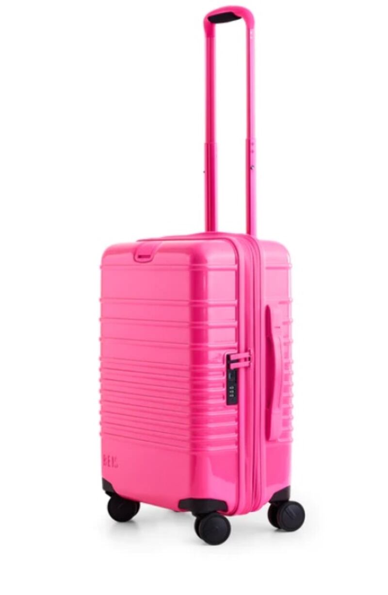 Carry-on roller in Barbie Pink, $218, www.beistravel.com. Photo: Beis / Mattel 2023