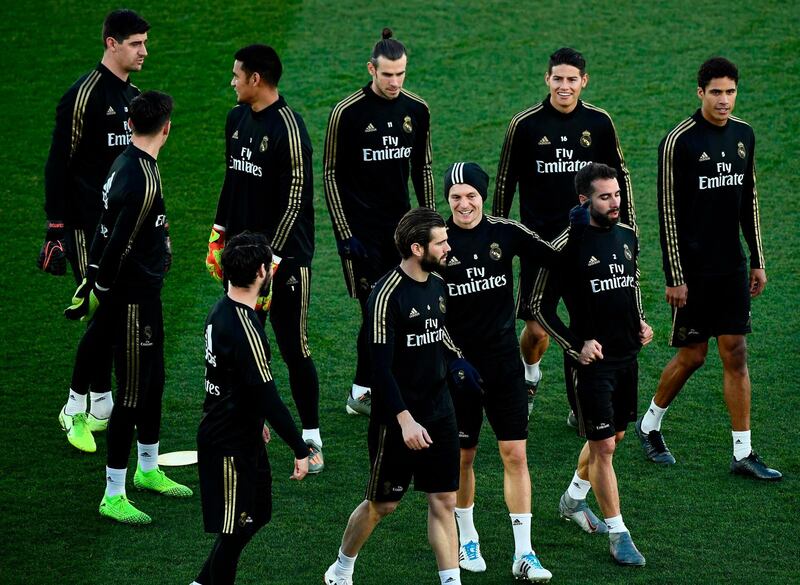 Real Madrid's players, including Gareth Bale, back row centre, during a public training session. AFP