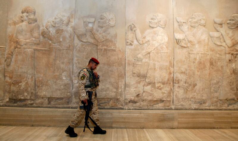 An Iraqi security officer in the Assyrian hall at the Iraqi Museum. The museum, the pride of the nation, reopened in 2009, almost six years after its ancient treasures were looted after the US-led invasion.