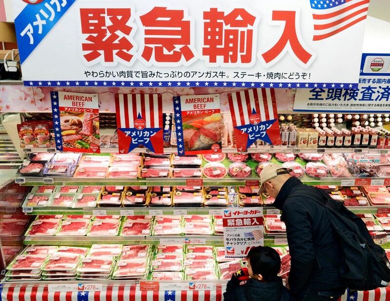 FILE - In this Feb. 16, 2019, photo, packs of frozen beef imported from the U.S. are sold at a supermarket in Tokyo.  Japanâ€™s Parliament has approved a trade deal that was agreed upon by President Donald Trump and Japanese Prime Minister Shinzo Abe earlier this year. The deal cutting tariffs between the countries takes effect at the beginning of next year. Some critics say the deal is more advantageous to the U.S. since a 2.5% tariff on Japanese automobiles remains. The deal will pave the way for cheaper American beef and other agricultural products in Japan.
The banner in the background reads: "Emergency import." (Kyodo News via AP, File)/Kyodo News via AP)