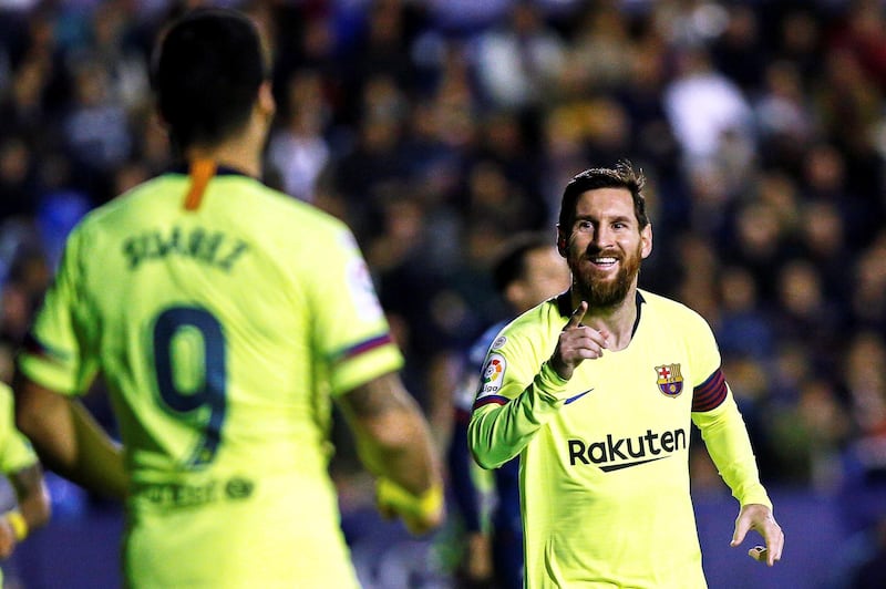 Lionel Messi celebrates with his teammate Luis Suarez. EPA