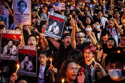 Activists take part in a demonstration in Manila to mark the 51st anniversary of the imposition of martial law in the Philippines, by Ferdinand Marcos Sr. Getty Images