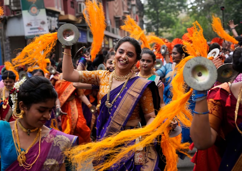 Women dance during a Gudi Padwa procession in Mumbai. AP