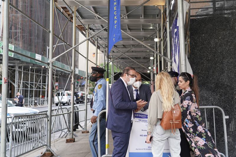 Police talk with pedestrians at a checkpoint on 2nd Avenue near the UN. Willy Lowry / The National