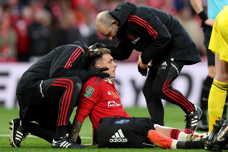 Lisandro Martinez of Manchester United receives medical treatment after a clash of heads. Getty 