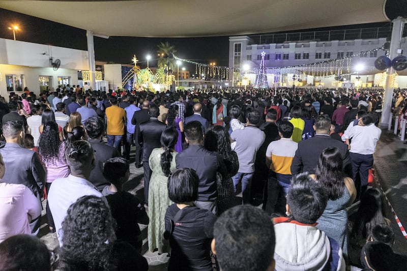 DUBAI, UNITED ARAB EMIRATES. 25 DECEMBER 2019. Midnight Mass at St Mary’s in Dubai to celebrate Christmas. People stand patiently during the ceremony. (Photo: Antonie Robertson/The National) Journalist: None. Section: National.
