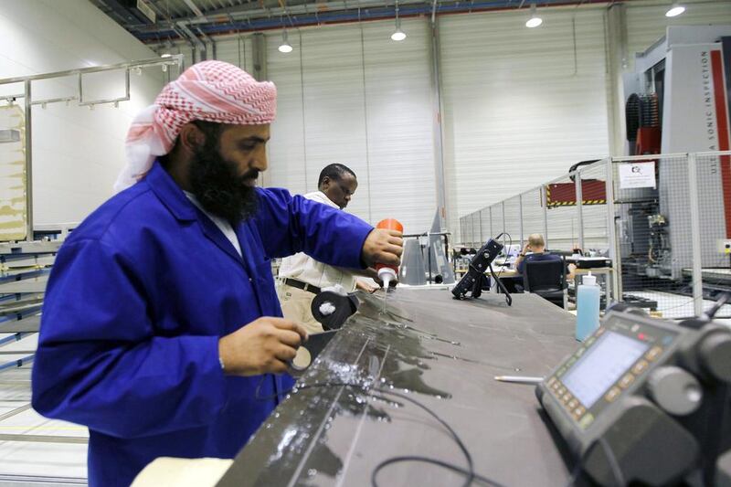An operator inspects components at Strata's manufacturing plant in Al Ain. (UAE-AEROSPACE/ REUTERS/Jumana El Heloueh)