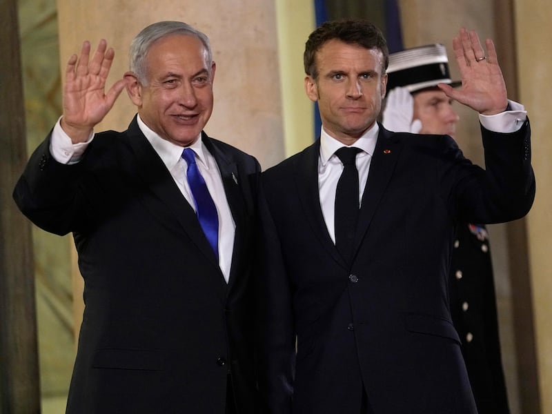 French President Emmanuel Macron and Israeli Prime Minister Benjamin Netanyahu in Paris on Thursday. AP