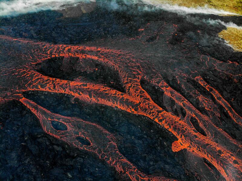 Lava burns pathways as the volcano erupts south-west of the Icelandic capital Reykjavik 