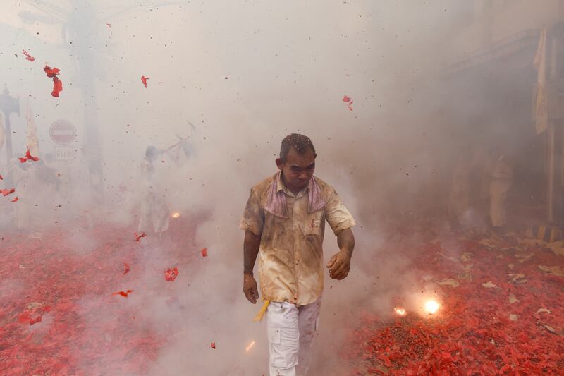 Firecrackers explode in a procession during an annual vegetarian festival observed by Taoist devotees from the Thai-Chinese community in the ninth lunar month of the Chinese calendar, in Takua Pa in Phang Nga province, Thailand. Reuters