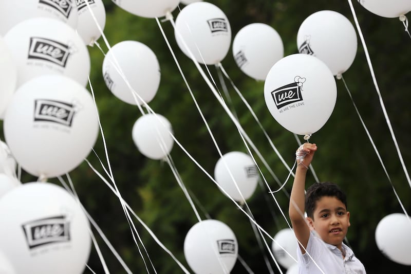 A boy holds a balloon during a demonstration in solidarity with people in northwest Syria, in Ankara, Turkey. Reuters