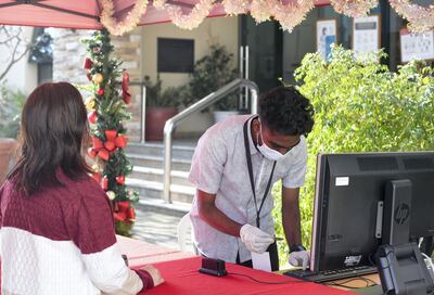 Abu Dhabi, United Arab Emirates - Registration checks for Christmas mass at St. JosephÕs Cathedral, in Mushrif. Khushnum Bhandari for The National