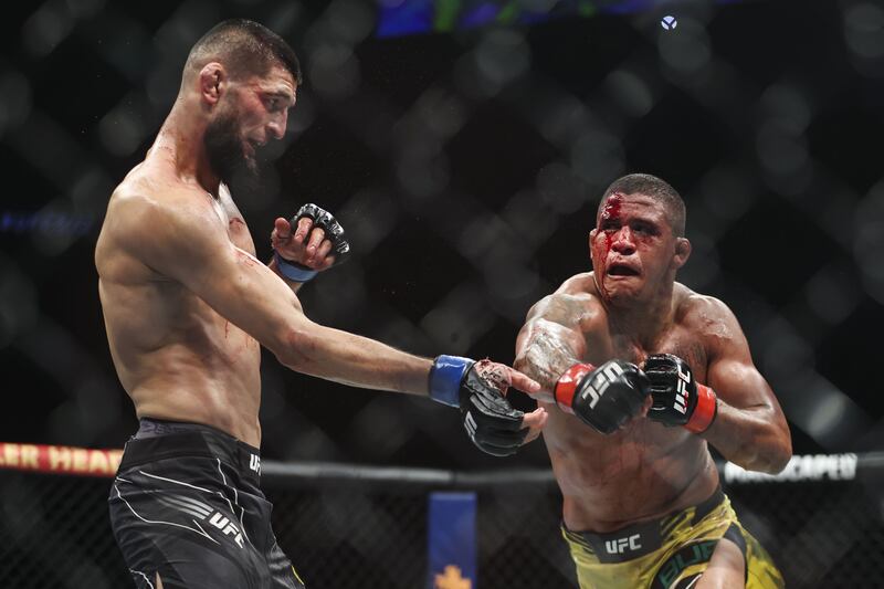 Gilbert Burns and Khamzat Chimaev during their welterweight bout at UFC 273. AFP
