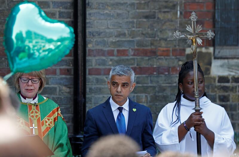 London Mayor Sadiq Khan joins The Bishop of London Right Rev Sarah Mullally and other members of the congregation, at a dedication service for the St Clement Garden of Peace and Healing remembering those affected by the Grenfell Tower fire at St Clement's Church in west London, Britain, June 10, 2018. REUTERS/Peter Nicholls