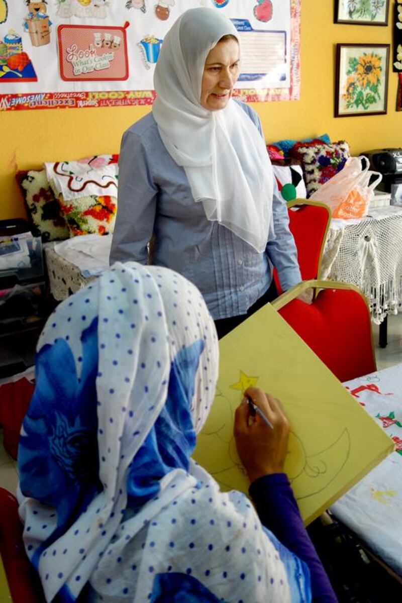 ‘Mama’ Yousra works with the women who have been victims of human trafficking and who stay at Ewa’a shelter while their court cases are decided in Abu Dhabi. She is also helping them prepare their artwork.