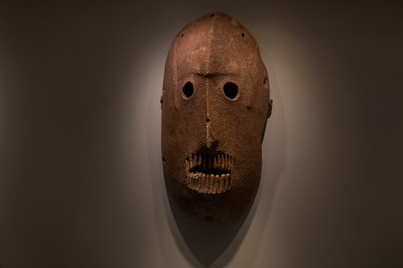 A Neolithic mask from American billionaire Michael Steinhardt's collection is displayed at the Israel Museum in Jerusalem. AP