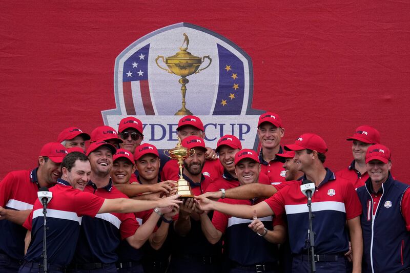 USA players with the Ryder Cup after their record 19-9 victory over Europe at Whistling Straits in Wisconsin on Sunday, September  26. AP