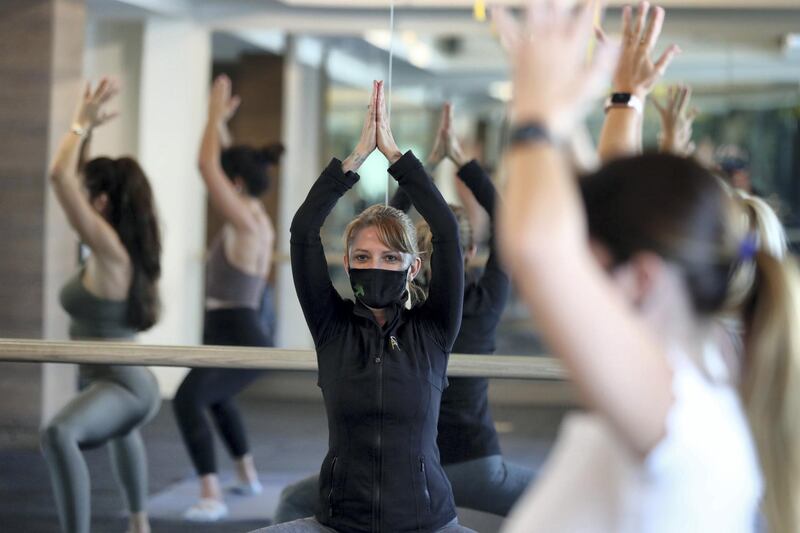 Dubai, United Arab Emirates - Reporter: N/A. News. Coronavirus/Covid-19. Visitors to Reform Athletica yoga studio perform their exercises with Covid mask on. Wednesday, November 11th, 2020. Dubai. Chris Whiteoak / The National