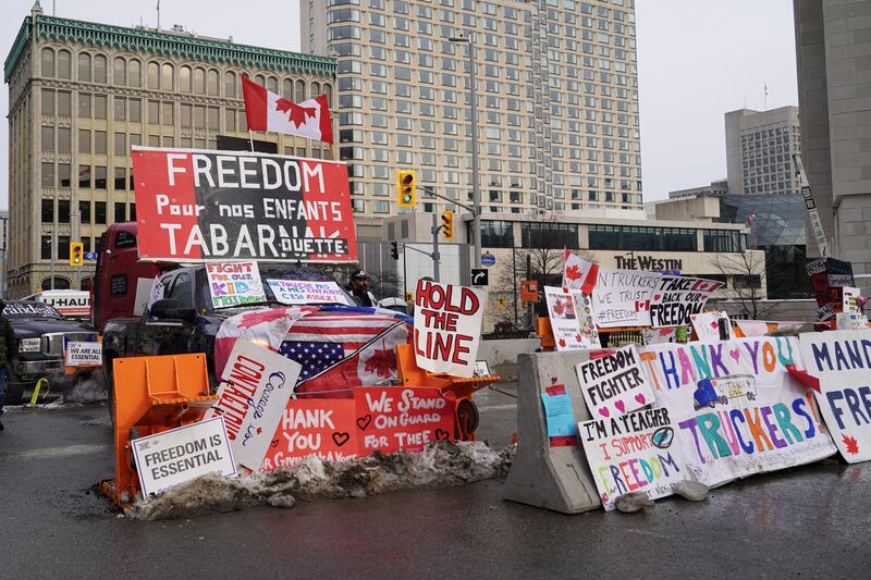 Ant-vaccine signs litter and block a city intersection in central Ottawa.  Willy Lowry / The National