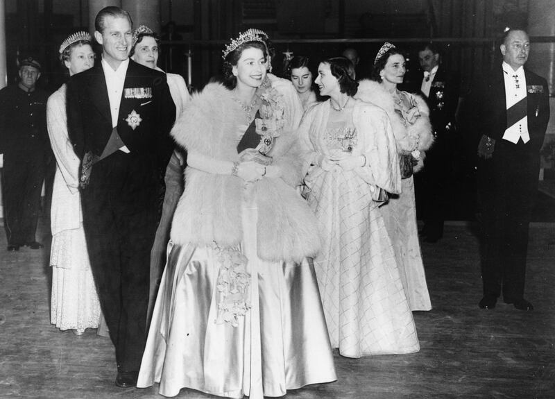 HM Queen Elizabeth II and Prince Philip, the Duke of Edinburgh, wearing formal dress as they attend a concert at Festival Hall, London, May 1951. (Photo by Hulton Archive/Getty Images)