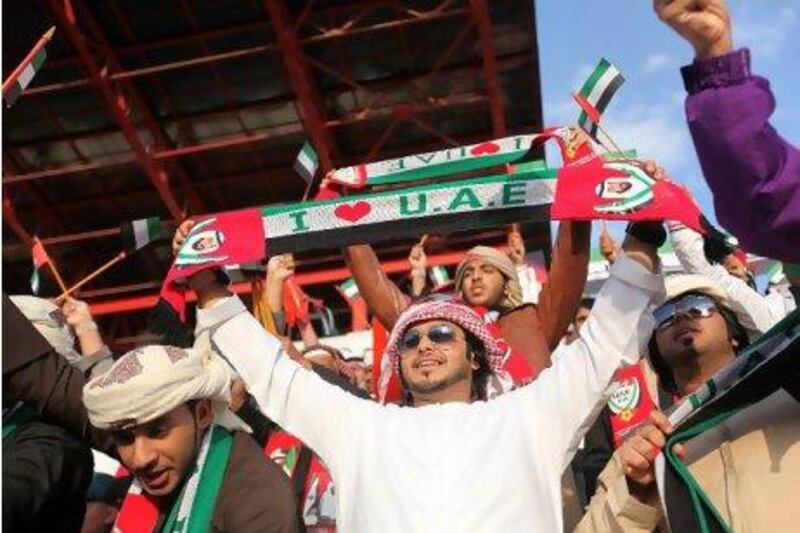 UAE fans cheer on the national team before the start of the game against Uzbekistan.