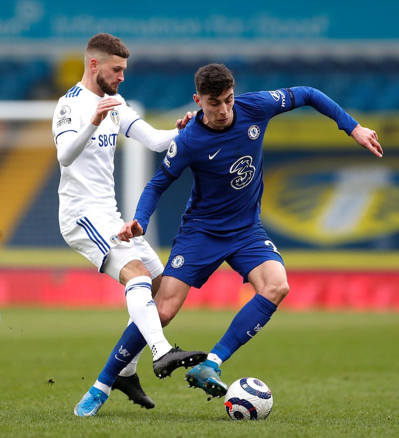 LEEDS, ENGLAND - MARCH 13: Kai Havertz of Chelsea is challenged by Mateusz Klich of Leeds United during the Premier League match between Leeds United and Chelsea at Elland Road on March 13, 2021 in Leeds, England. Sporting stadiums around the UK remain under strict restrictions due to the Coronavirus Pandemic as Government social distancing laws prohibit fans inside venues resulting in games being played behind closed doors. (Photo by Lee Smith - Pool/Getty Images)