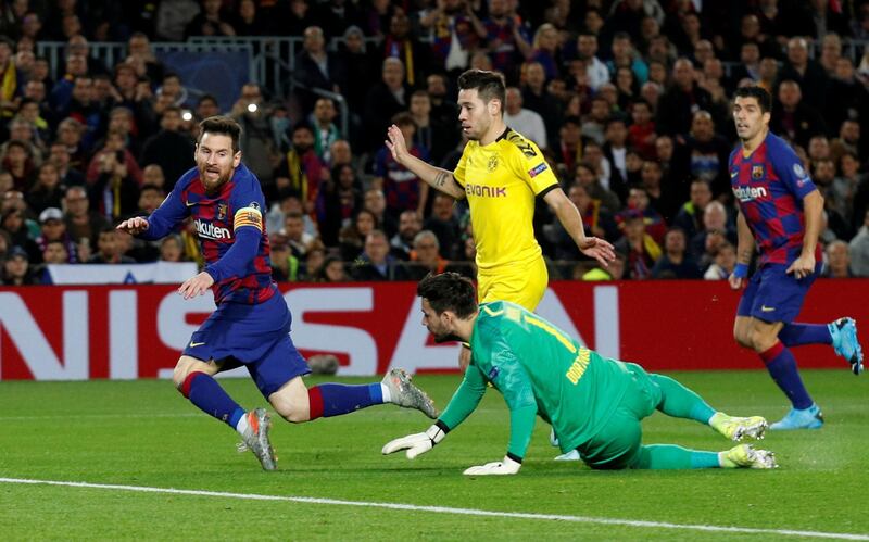 Barcelona's Lionel Messi goes down and is subsequently shown a yellow card for diving. Reuters