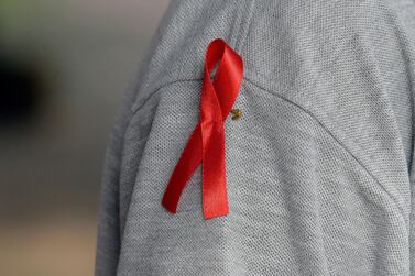 The red ribbon, an international symbol of HIV/Aids, is worn to raise the awareness in the fight against HIV infection. EPA